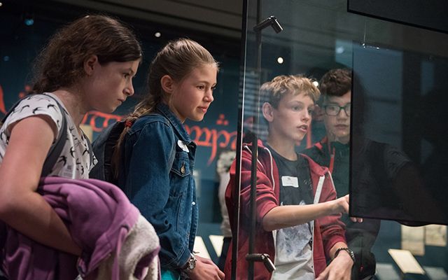 Group of children looking at an exhibition