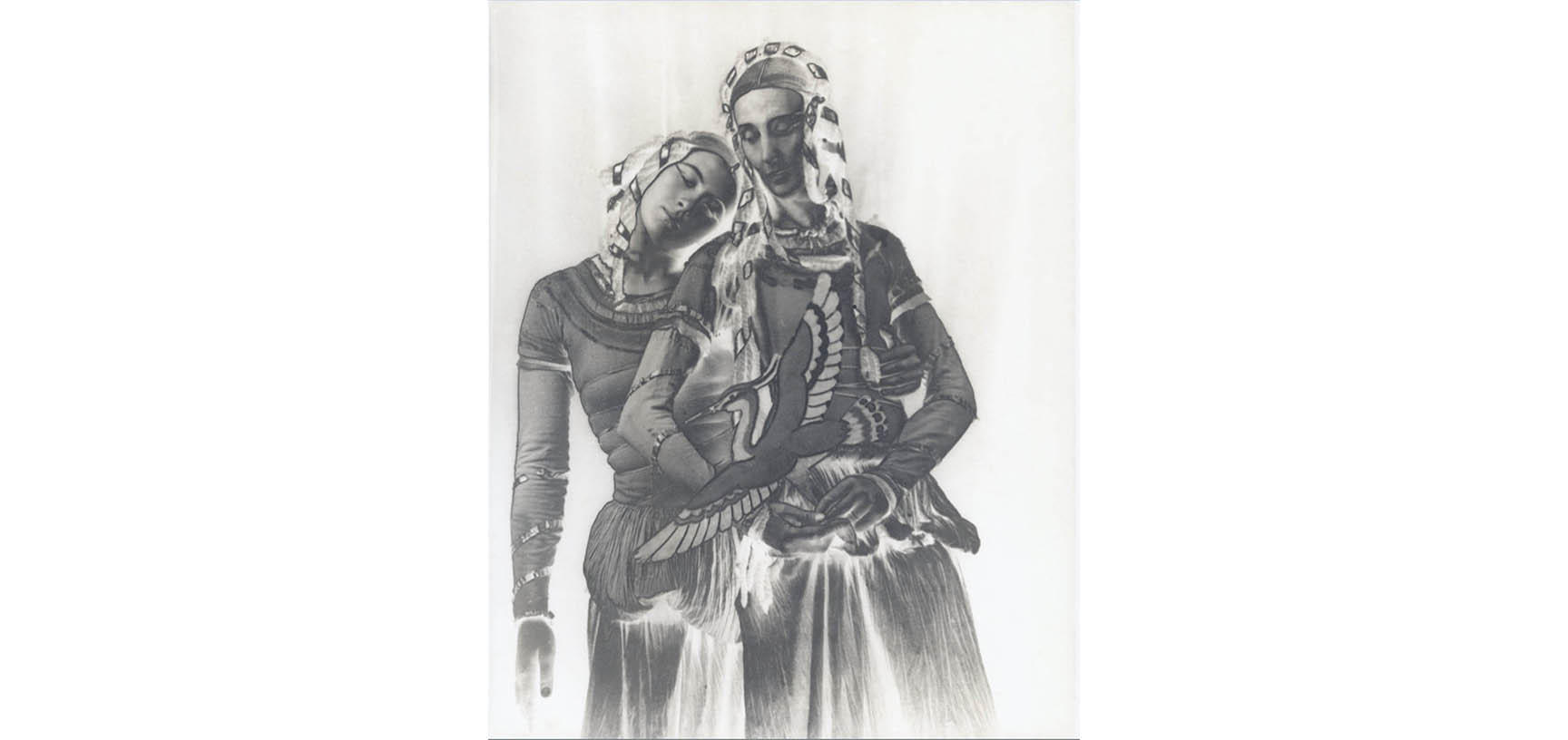 Two women standing next to each other dressed in costume