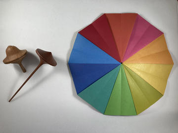 Locke Unlocked: Primary and Secondary Qualities A wooden spinning top next to a colour wheel showing blue, green, yellow, orange, pink and red segments