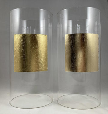 Locke Unlocked: Substance and Substratum Two plastic cylinders next to each other - each has a square of gold-looking material on it